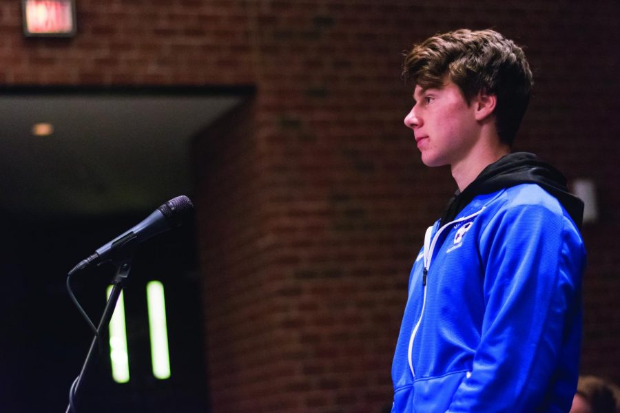 Senior Kasey Dresser stands at the microphone as one of the many students to ask the court a question during the Q&A session.