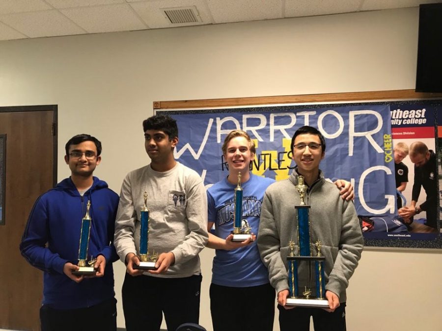 The Division 1 Team (left to right) Kailash Kalyanasundaram, Srikar Yallala, senior Kasper Hoermann, and junior Khoa Nguyen pose for a picture with their awards they won. This team swept the State competition, and they won overall.