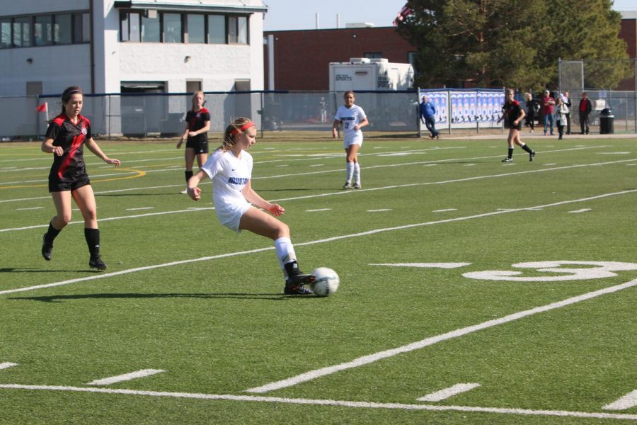 Freshman Campbell Zimmers dribbles the ball up field. The team played Westside and won the game in a shootout.