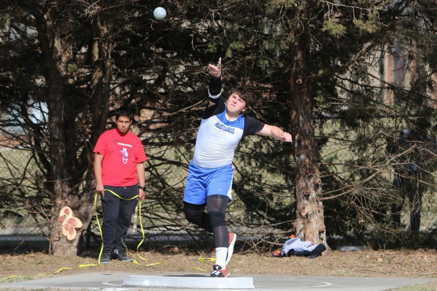 Junior Kevin Shubert throws shot put in a meet against Millard South. As a sophomore, Shubert placed tenth place at State.