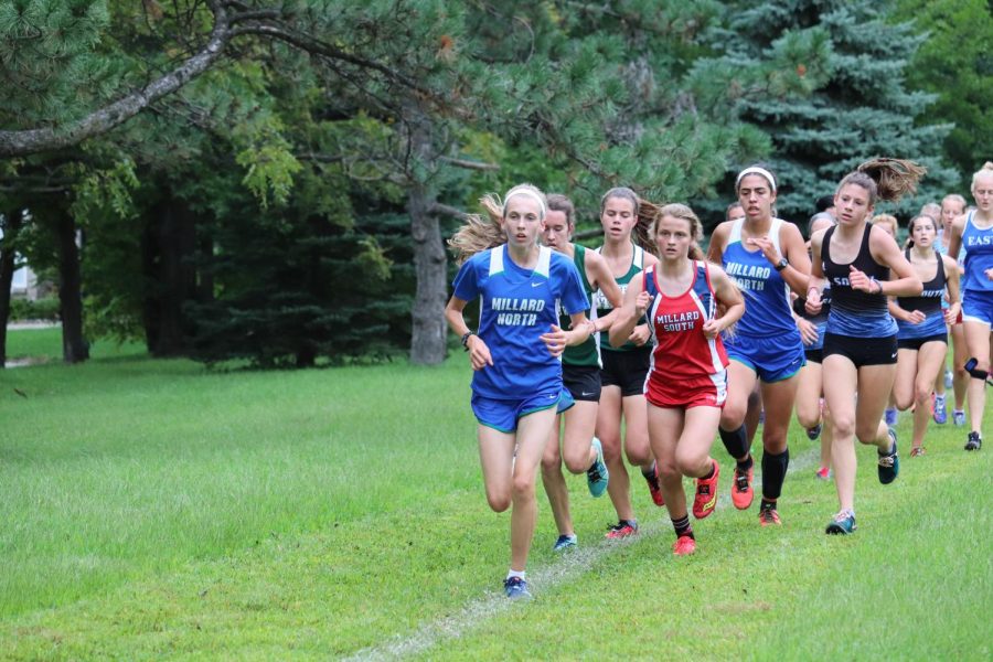 Sophomore Allison Louthan leads the pack of runners at the Millard South 
Invitational on Sept.7. Individually, Louthan placed 4th overall at the meet, leading the team to an 8th place finish.