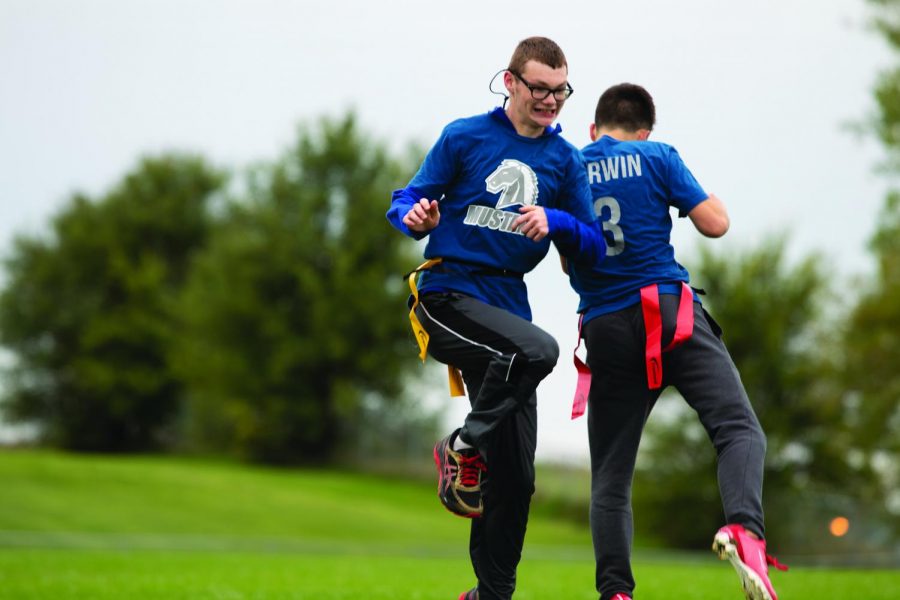 Sophomore+Ryan+Rauert+and+and+2019+graduate+Zach+Corwin+congratulate+each+other+on+their+teams+touchdown.+The+MN+Unified+Flag+Football+team