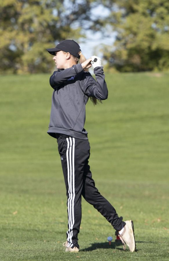 Sophomore+Katelyn+Ruge+looks+down+the+fairway+after+taking+a+practice+swing.+Ruge+later+won+districts+at+Holmes+Golf+Course+in+Lincoln+with+a+78.