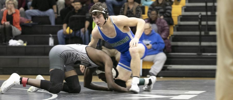 Junior Guillermo Espinoza, stares down the competition after a tackle. Espinoza has won 25 matches this season.