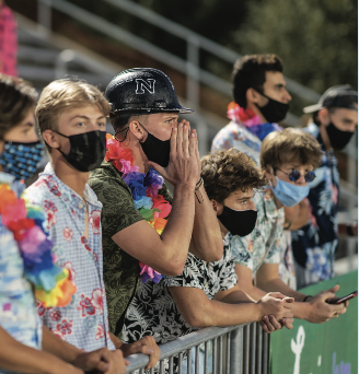 Senior Aidan Agosta cheers at the home game against Lincoln East on Sept. 17. Agosta was given the Hard Hat by graduate Austin Zorinsky during the spring.