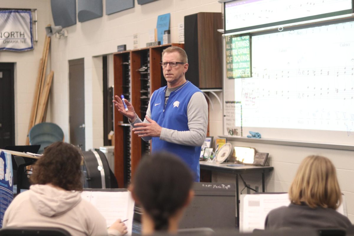 Placek stands in front of his AP Music Theory class during a class activity. He helps his students review song keys as they prepare for their upcoming exam. 