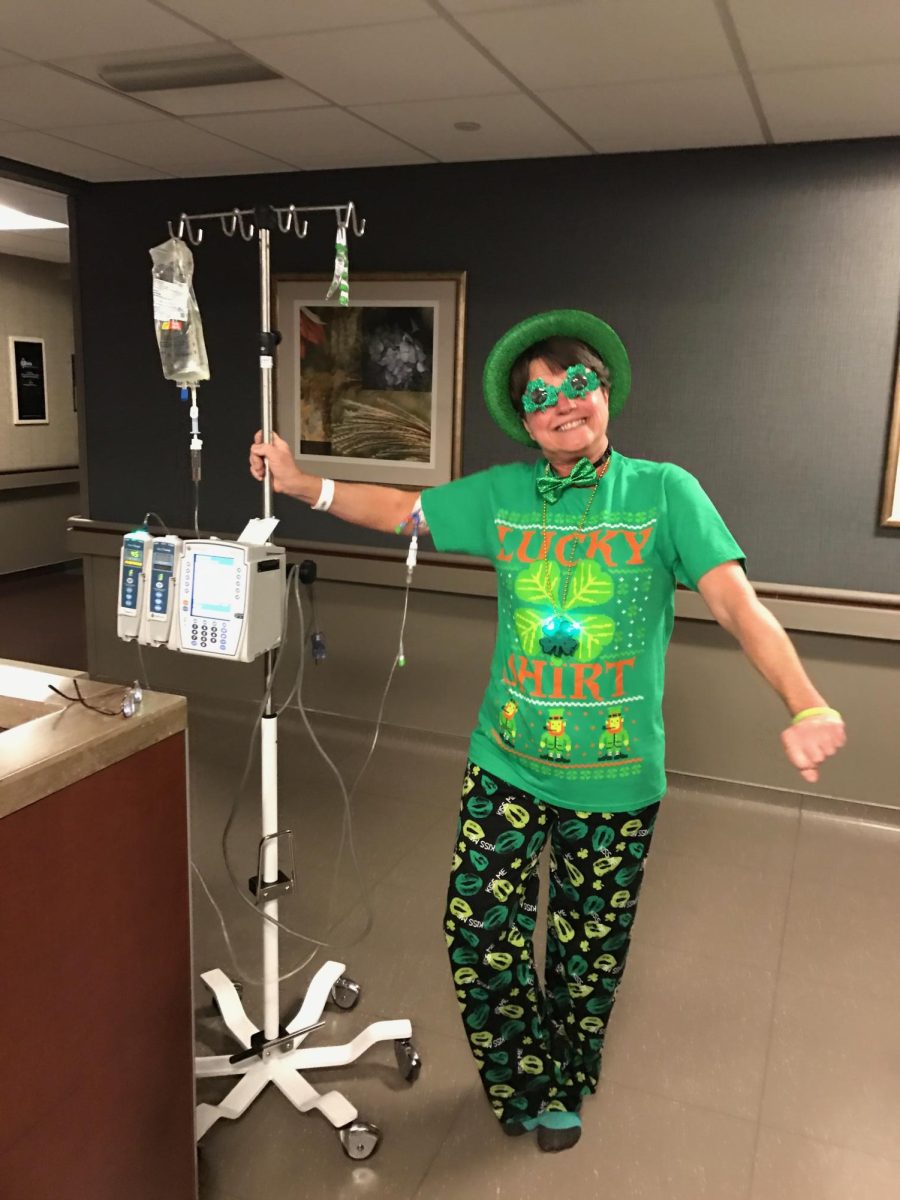 Kathy Folk stands decked out in green during treatment on St. Patricks Day. She is not only wearing green for the holiday, but also for non-Hodgkin's awareness