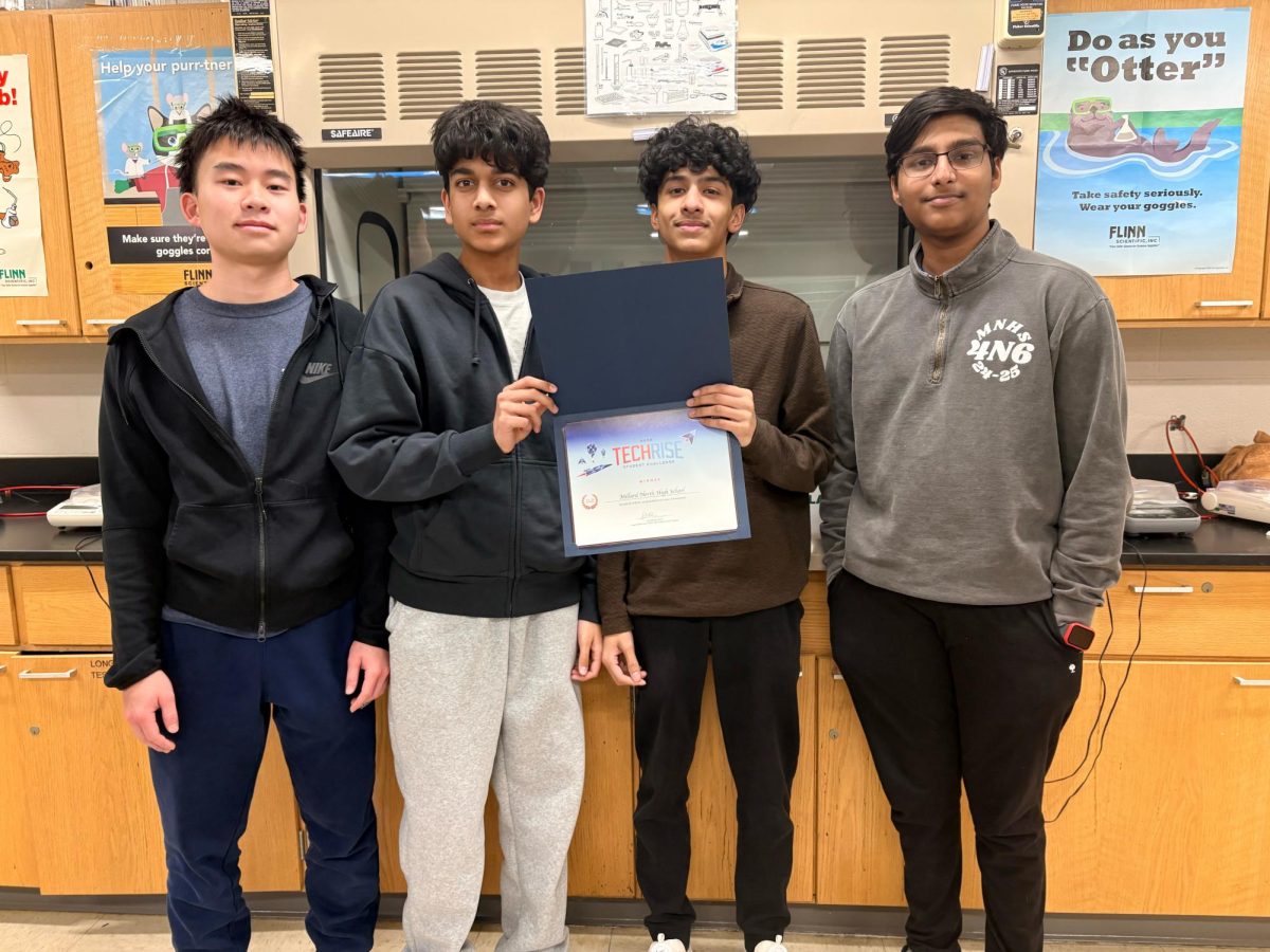 Sophomores Nathan Yeh, Ketan Valluru, Mahesh Yandra, and Prajwal Rao Ragi recieve a certificate for their selection of the “Lunar Glow Pathfinder.” Their project will launch later this year.