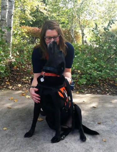 Carlson and her late service dog Grace taking a stroll in the park. Grace was integral for supporting Carlson’s diabetic needs.